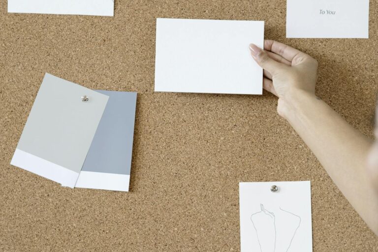 Person Holding White Printer Paper