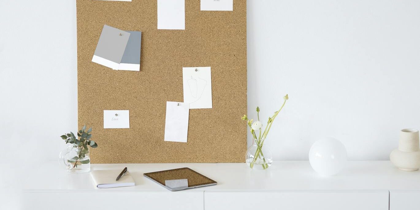 White Wooden Cabinet With Brown Wall Decor