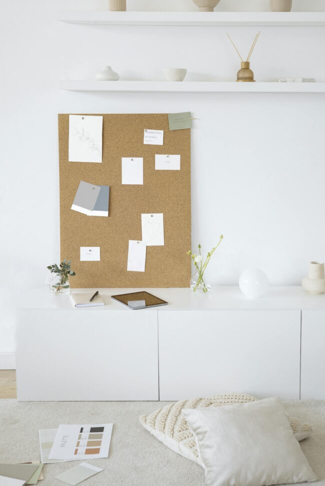 Photo by Anna Nekrashevich White Wooden Cabinet With Brown Wall Decor