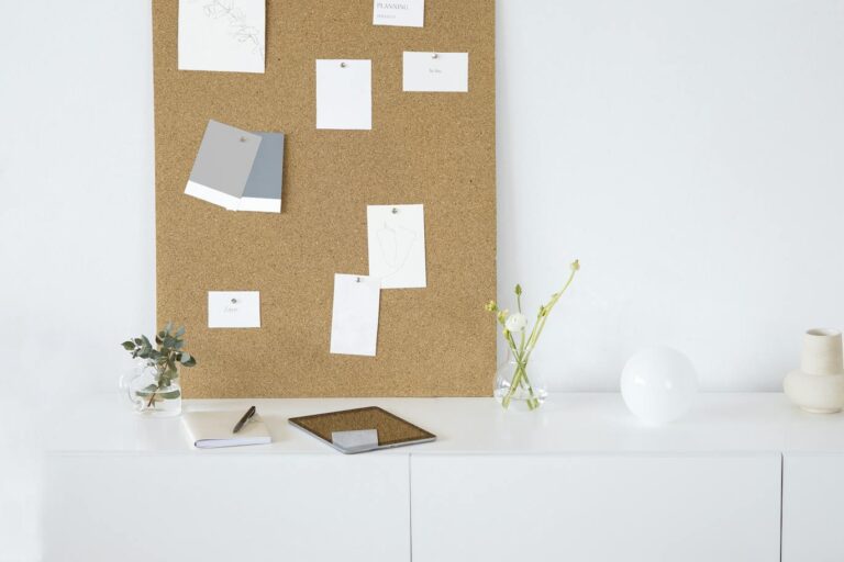 White Wooden Cabinet With Brown Wall Decor